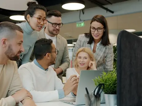 Office team working together at a computer
